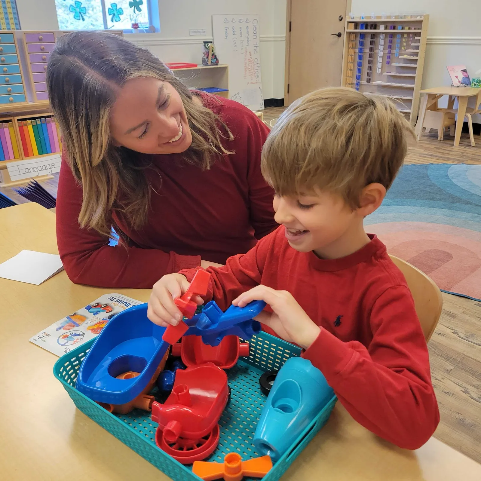 A guide and a young learner working together at Acton Academy Eastside