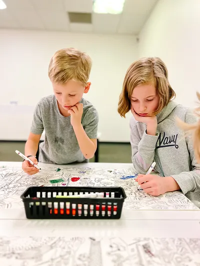 Children working together at a table in Explorer Studio