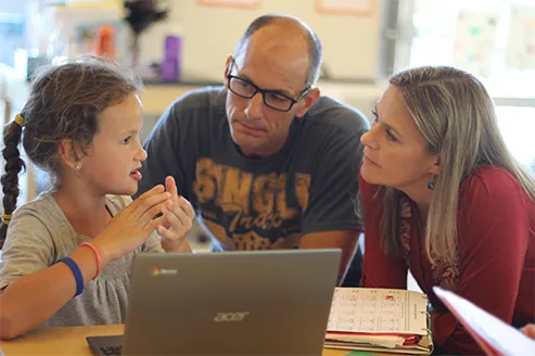 Parents and child learning together at Acton Academy Eastside